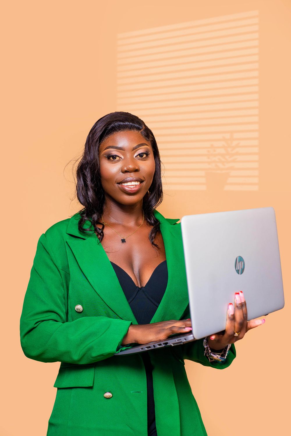 African professional woman using a laptop for analytics work